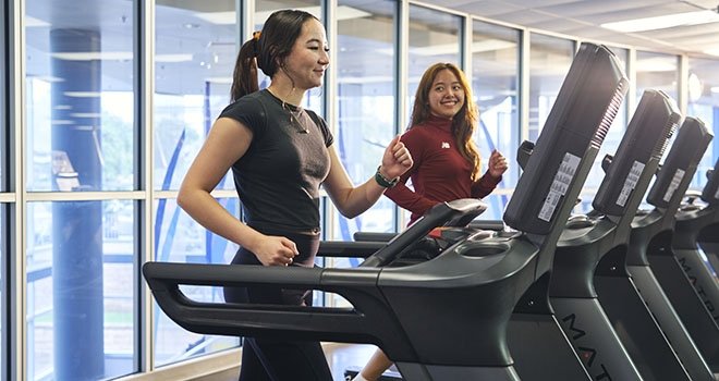 two women on treadmills