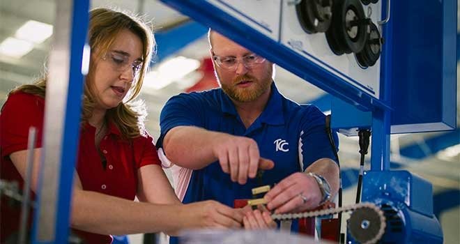 TCC Manufacturing Engineering Technology student working on an airplane with professor