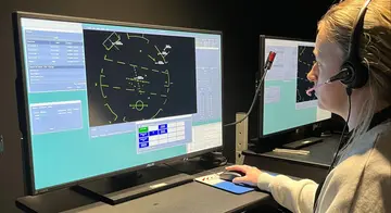 Rebecca Nobles looks at a computer screen