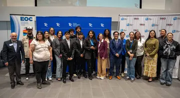 About a dozen TRIO students and staff pose for a photo with TCC President Leigh Goodson and Tulsa Deputy Mayor Krystal Reyes.