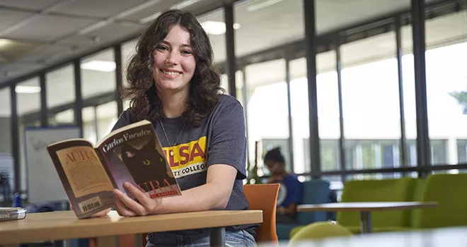 brunette woman reading book