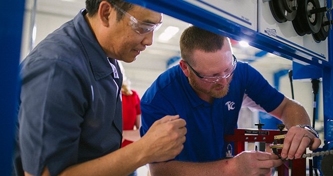 TCC instructor teaches engineering tech student.