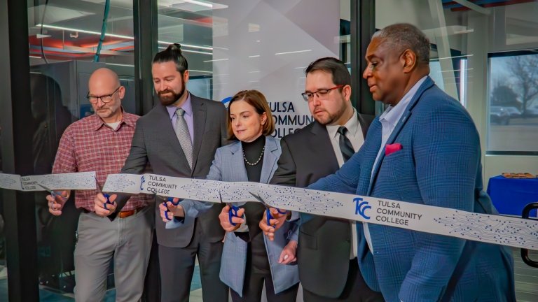 TCC leadership cuts a ribbon outside of the Cybersecurity Lab